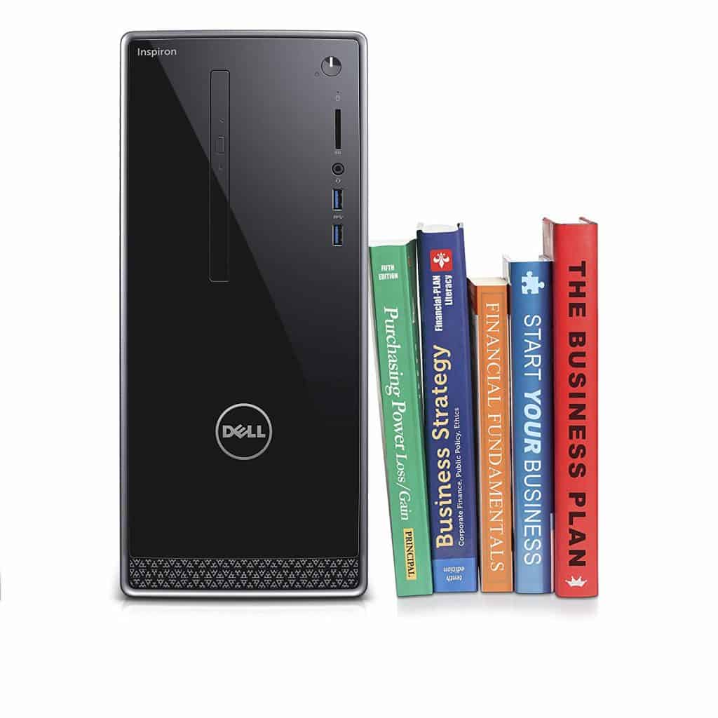 Image of the Dell Inspiron i3650-5609SLV Desktop next to books