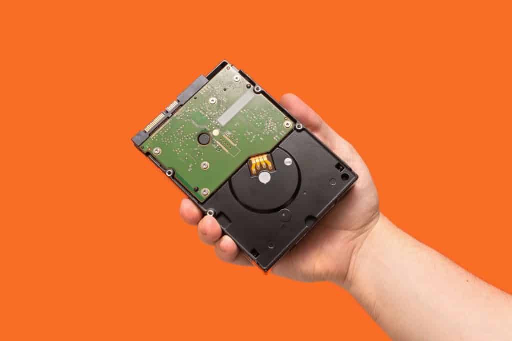 Person holding a hard disk drive storage for gaming
