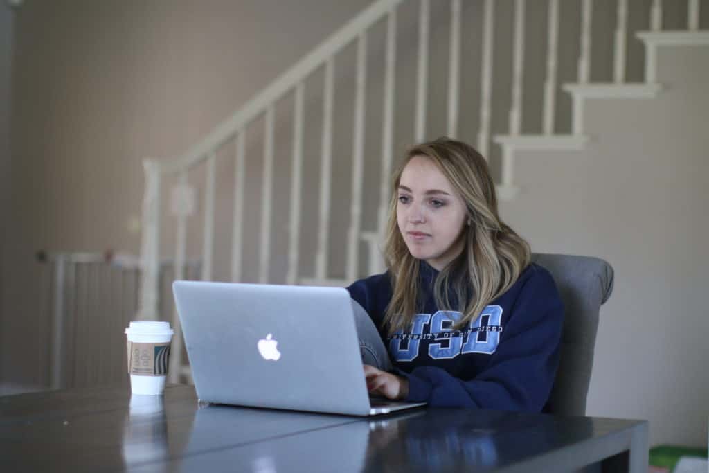 Finance major student using her laptop at home