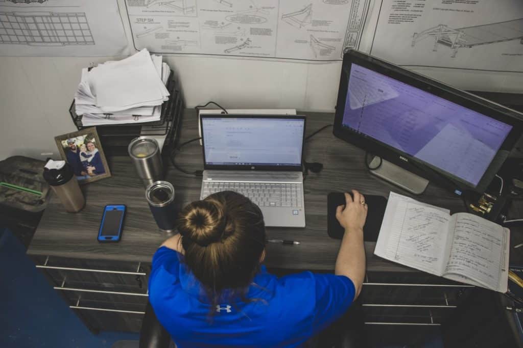 Woman using a laptop on her desk