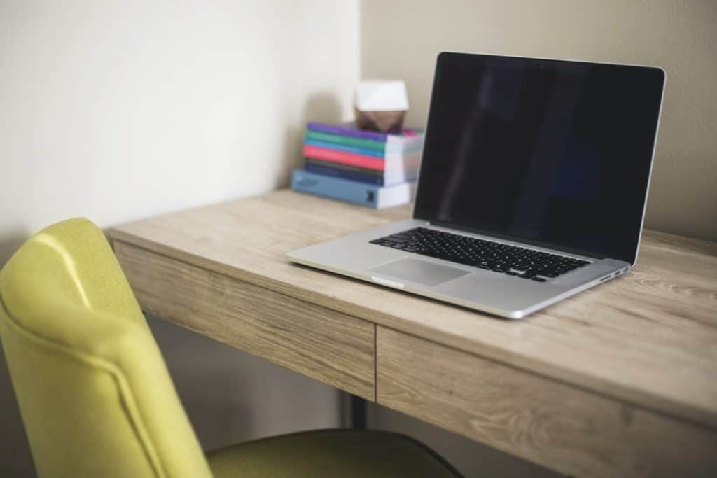 Silver MacBook on a study desk