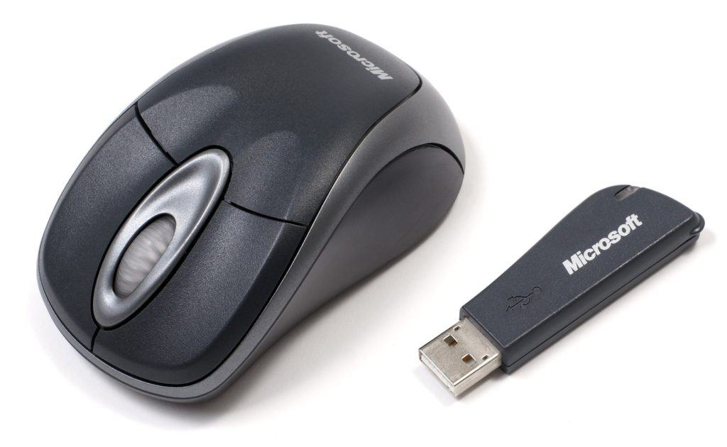 A wireless mouse with a USB cable