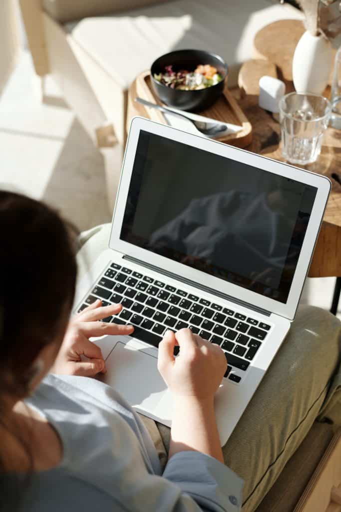 Woman typing in her laptop