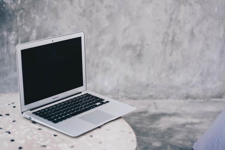 Silver MacBook placed on the table