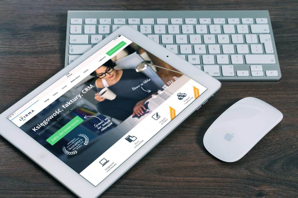 Wireless mouse being used with an iPad while a wireless keyboard is on the background