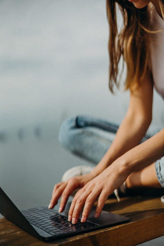 Woman typing in her laptop