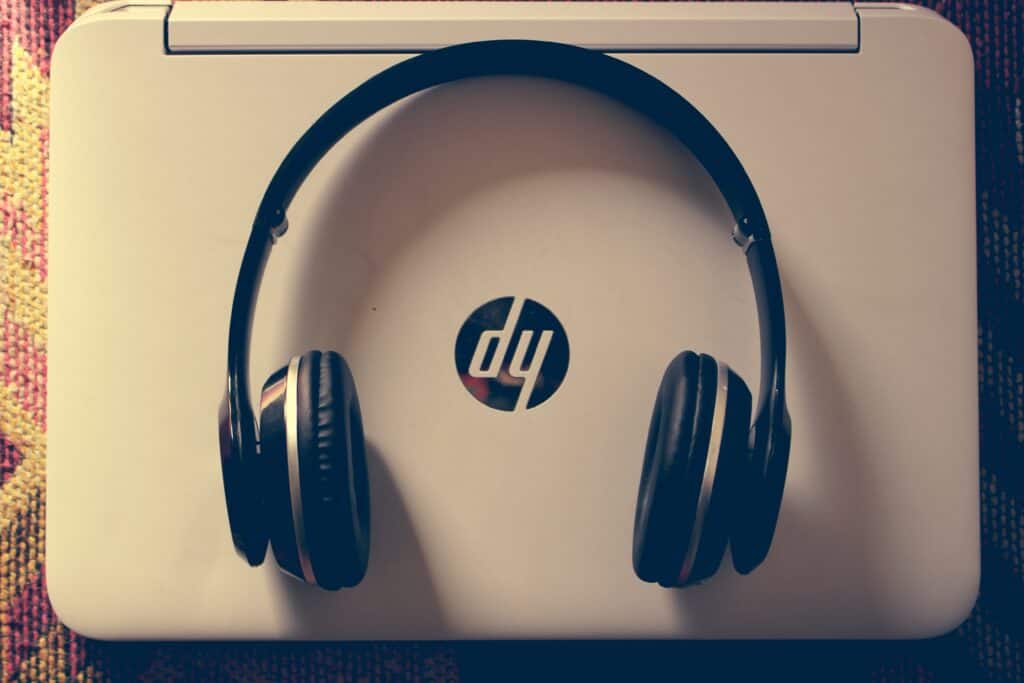 Headphone placed on top of an HP laptop