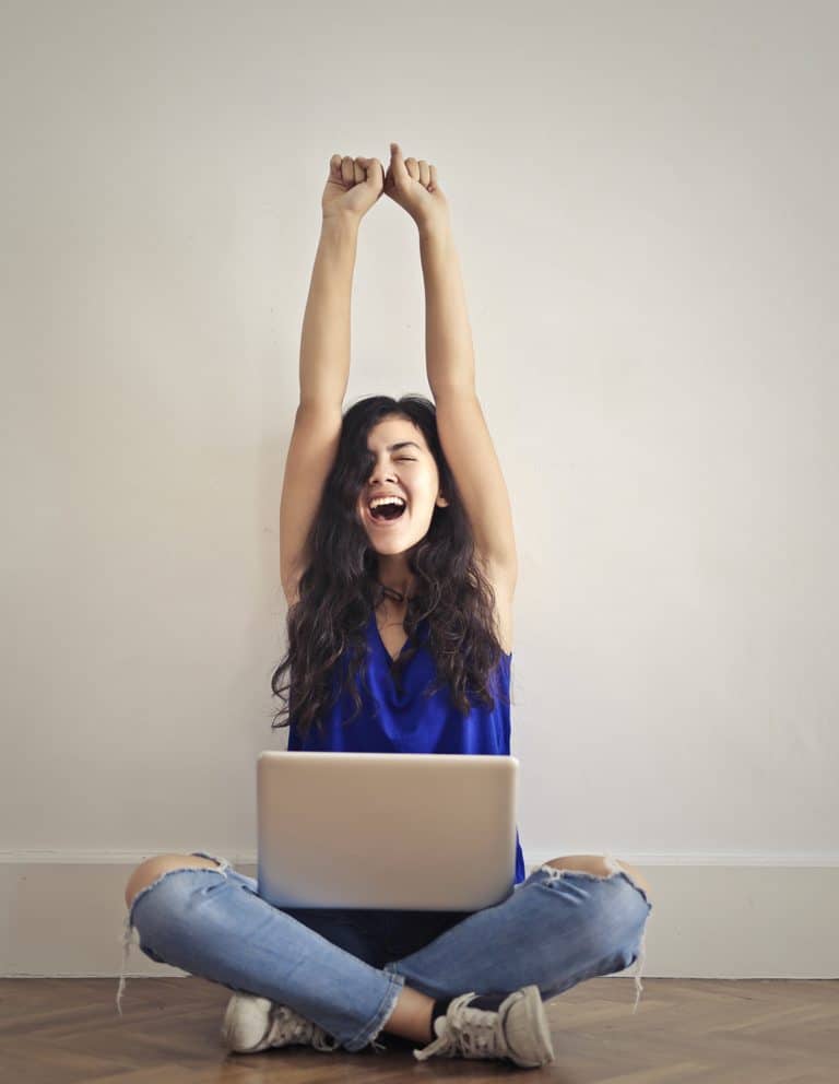 Woman elated while playing her game