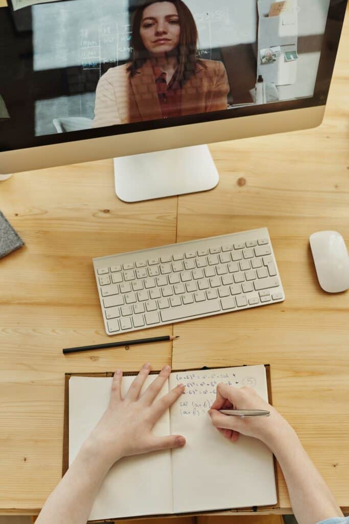 Woman using her desktop that has a wireless mouse