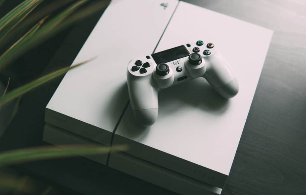 white playstation 4 console and controller